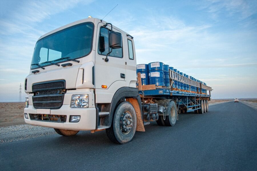 Commercial truck transporting goods with weighbridge solution for logistics and fleet management.