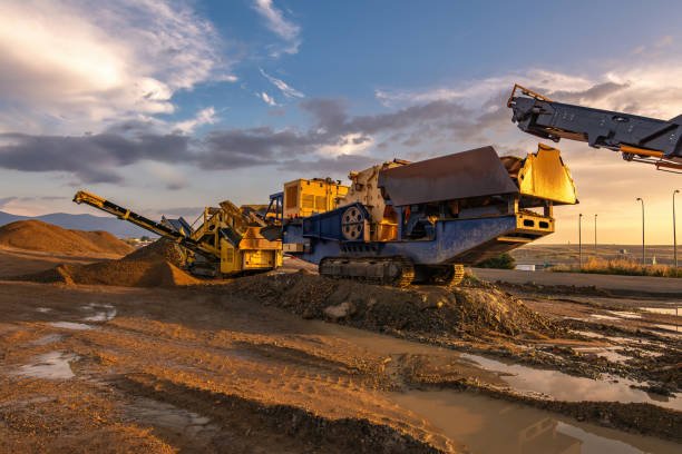 Mining excavator and dump truck using industrial weighbridge solutions at a mining site.